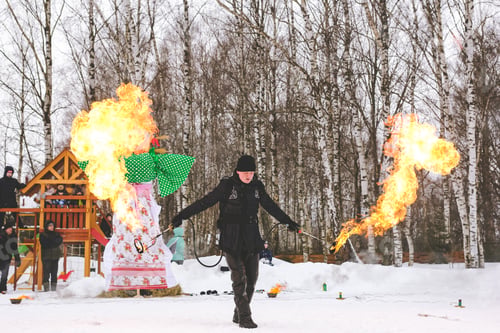 Preview: Fire show performance on Russian ethnic carnival Maslenitsa- Pancake week. Burning Maslenitsa doll