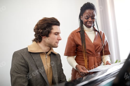 Preview: Teacher with student sitting at musical lesson
