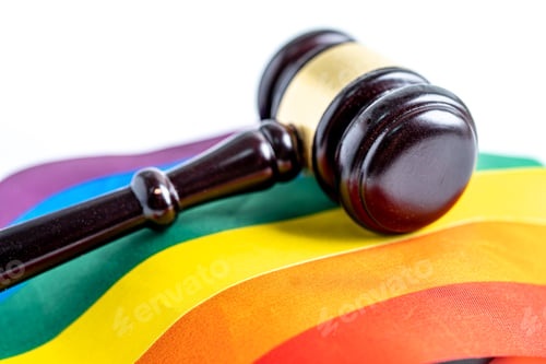 Preview: Gavel for judge lawyer on rainbow flag, symbol of LGBT pride month celebrate annual in June social