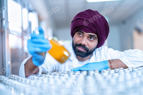 Preview: Beverage worker in drink factory stand working near drinking bottle conveyor production line