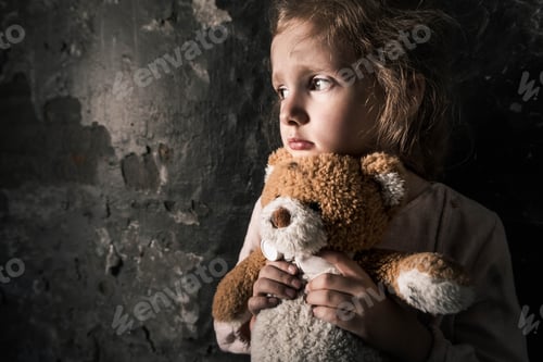Preview: upset kid holding teddy bear in dirty room, post apocalyptic concept