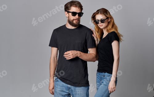 Preview: young fashion couple wearing sunglasses chatting hug romance studio isolated background