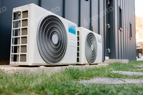 Preview: Two outdoor air conditioner units cooling modern building