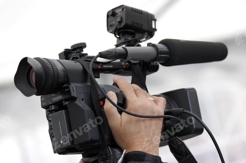 Preview: Hand of the cameraman holding video camera