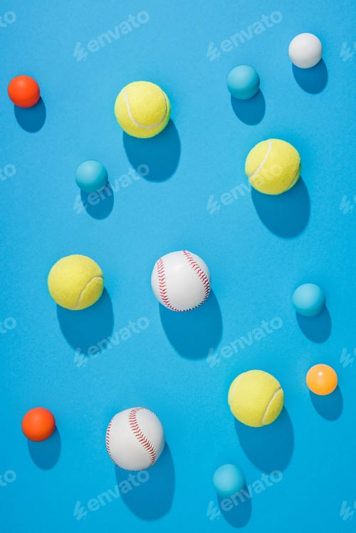 Preview: top view of arranged pin pong, tennis and baseball balls on blue background