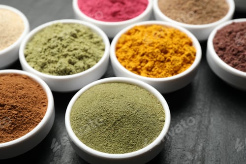 Preview: Different superfood powders on black table, closeup