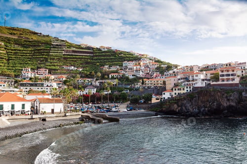 Preview: FISHING VILLAGE, MADEIRA ISLAND - February 20, 2022: Madeira scenic city in the marina view.