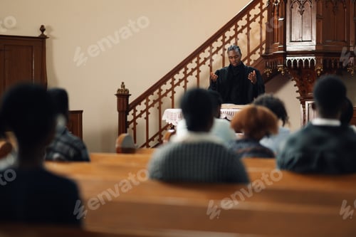 Preview: Young pastor preaching in front of congregation at church