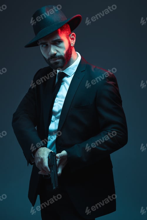 Preview: Man, suit or holding gun on dark studio background in secret spy, isolated mafia leadership or crim