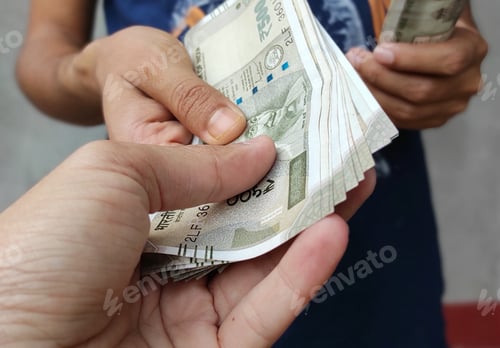 Preview: Money giving and receiving concept, cash in hand, Indian currency