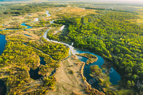 Preview: Aerial View Green Forest Woods And River Landscape In Sunny Spring Summer Day. Top View Of Beautiful
