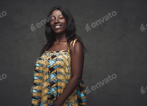 Preview: Black woman weared in dress against dark background