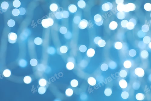 Preview: Blurred view of Christmas lights on color background