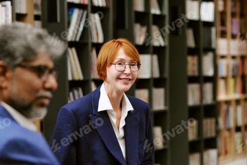 Preview: Middle Aged Caucasian Woman Smiling during Presentation in Library Setting