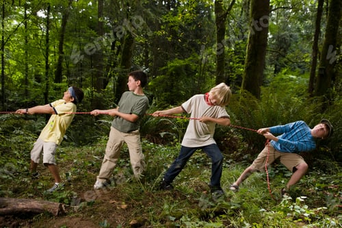Preview: Kids engaged in a lively tugofwar game in the woods