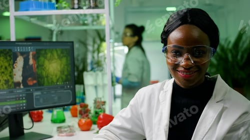 Preview: Portrait of botanist african woman working in microbiology laboratory