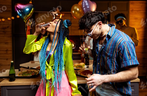 Preview: Group of friends making party at home on new year evening