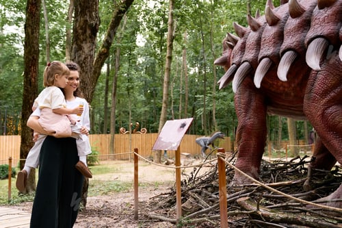 Preview: Joyful moments of a mother and daughter exploring an amusement park amid fascinating attractions