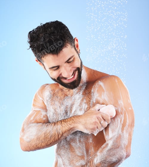 Preview: Soap, shower and man with water splash, smile and hygiene in studio for wellness, cleaning and groo