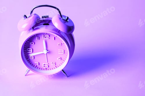 Preview: purple alarm clock on neon purple background. Minimal concept