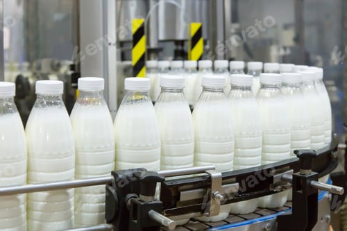 Preview: Factory producing milk or yogurt in to plastic bottles on conveyor line. Equipment at dairy plant.