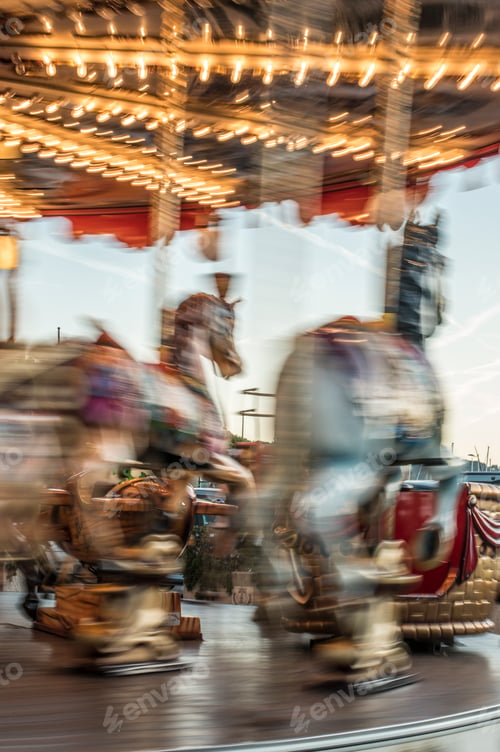 Preview: Carousel with horses in amusement park.