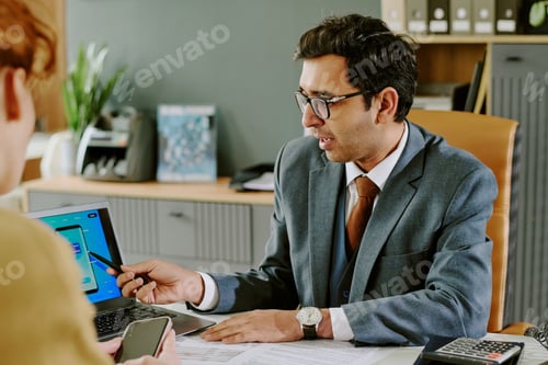 Preview: Businessman Presenting Information on Digital Tablet