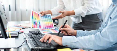 Preview: Two creative graphic designer team working on color selection an