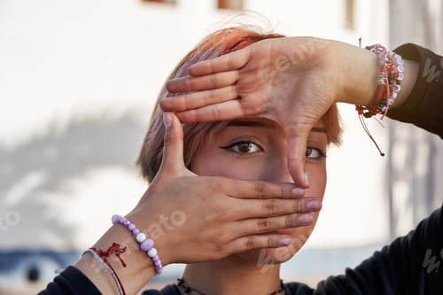 Preview: Young woman making a frame with her hands