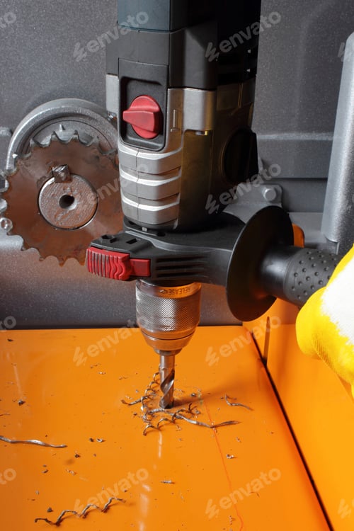 Preview: Worker is working with drill.