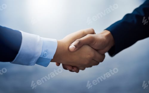 Preview: Closeup shot of two unrecognizable businesspeople shaking hands in an office