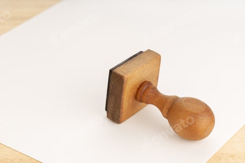 Preview: Vintage Rubber stamp and blank paper on wooden table