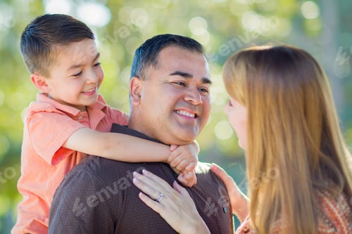 Preview: Happy Attractive Young Mixed Race Family Having Fun Outdoors.