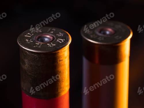 Preview: closeup of pictures, piles of rifle bullets on black background