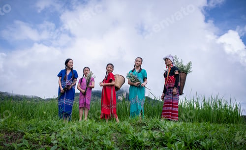 Preview: people, possibly from different generations, dressed in colorful traditional clothing, standing in a