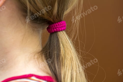 Preview: Hairdresser is cutting hair of a child girl in barber shop