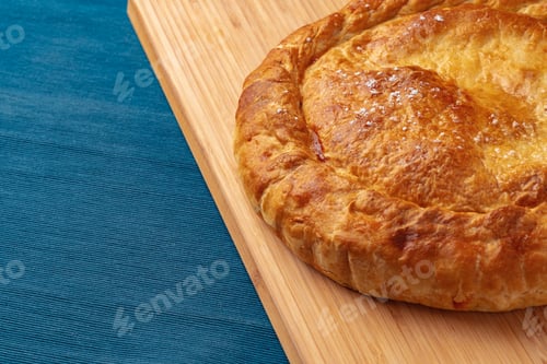 Preview: Apple pie on a wooden board close up