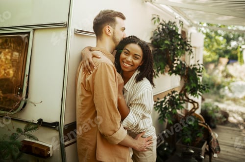 Preview: Love couple embraces in rv, camping in a trailer