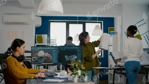 Preview: Industrial engineer putting on headset working at pc with two monitors