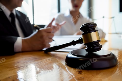 Preview: Judge gavel with Justice lawyers having team meeting at law firm background