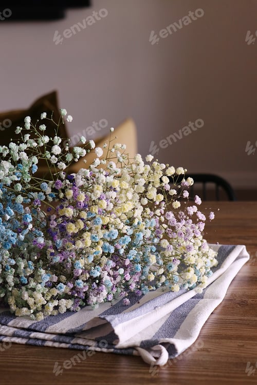 Preview: Colorful Gypsophila Bouquet on Striped Cloth Indoors