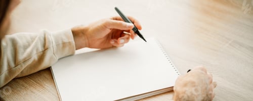 Preview: Banner with man hands writing in a blank notebook