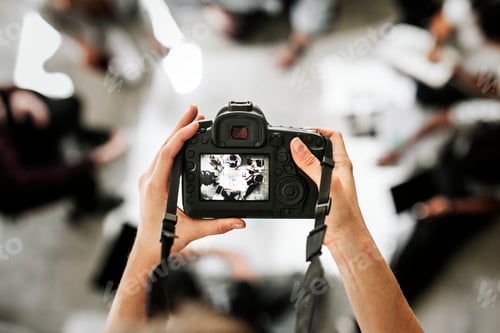 Preview: Woman taking a photo