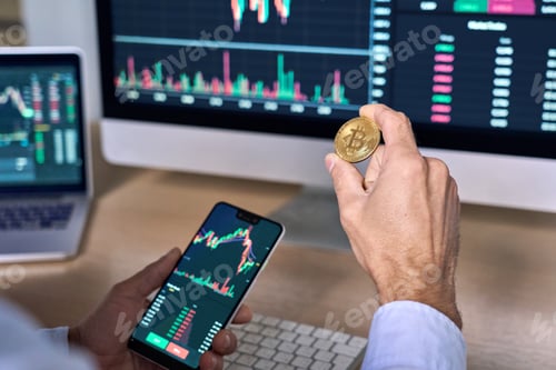 Preview: Cypto trader investor holding phone and coin buying bitcoin using mobile app.