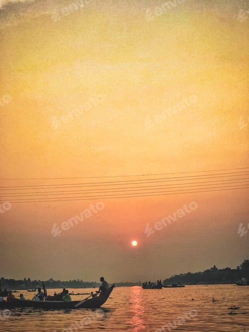 Preview: Passenger river boat passing through sunset