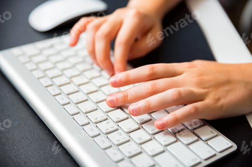 Preview: Teenage hands type on white keyboard close