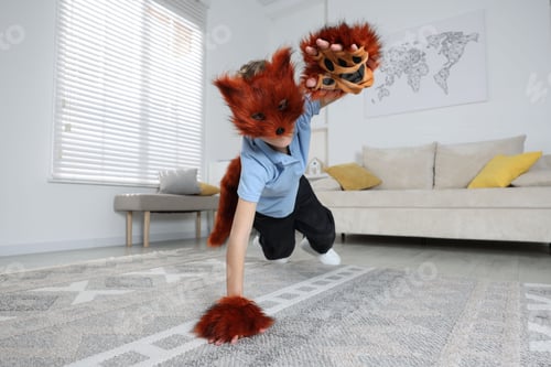 Preview: Quadrobics. Boy wearing fox mask, tail and gloves at home