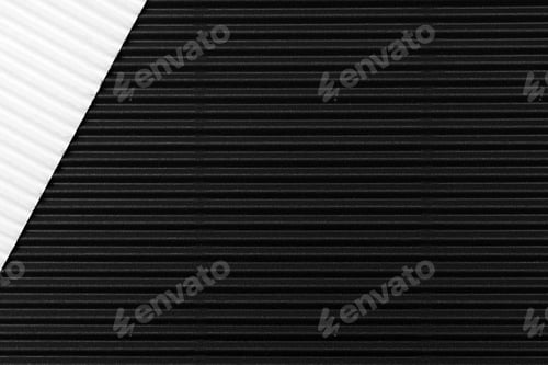 Preview: Closeup of black and white corrugated paper under the lights for textures and backgrounds