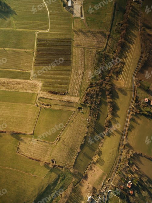 Preview: aerial view of agricultural fields on summer sunset, europe