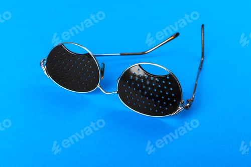 Preview: Two different type of glasses on blue background. Medical concept. Top view